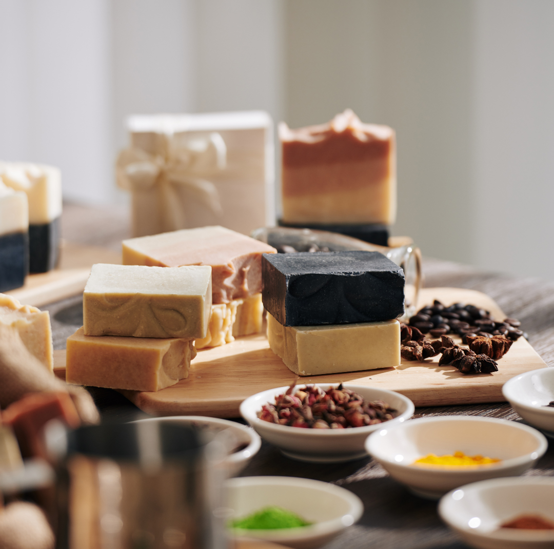 Handmade soaps on the table and herbs