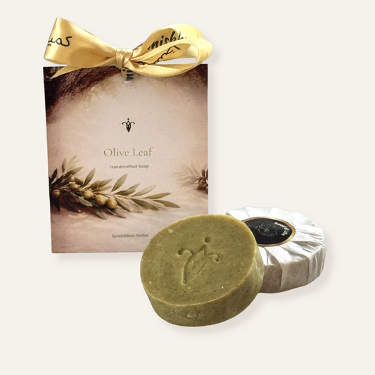 Olive Leaf soap with packaging featuring a gold bow on a white background