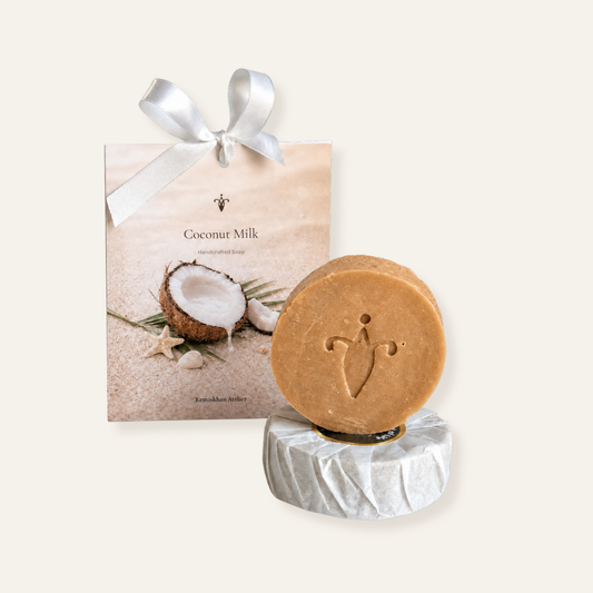 Coconut milk soap with packaging on a white background