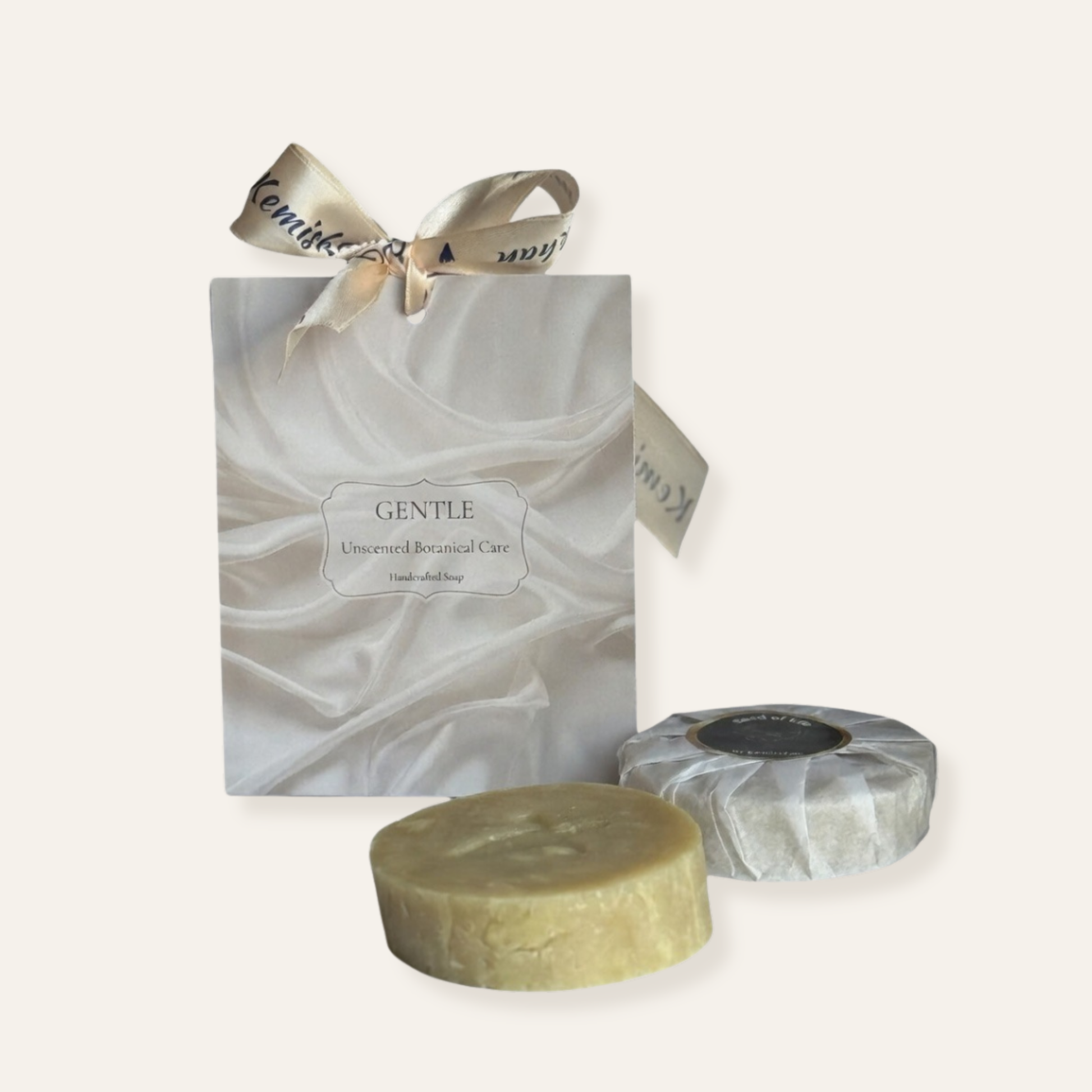 Two bars of soap and a gift bag with 'Gentle' branding on a white background